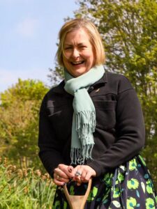 Alison Hume MP for scarborough and whitby planting a tree at st helens in the park caravan and campsite